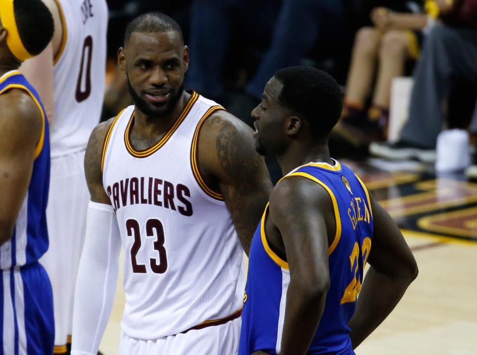 LeBron James and Draymond Green talk. They like talking. (AP)