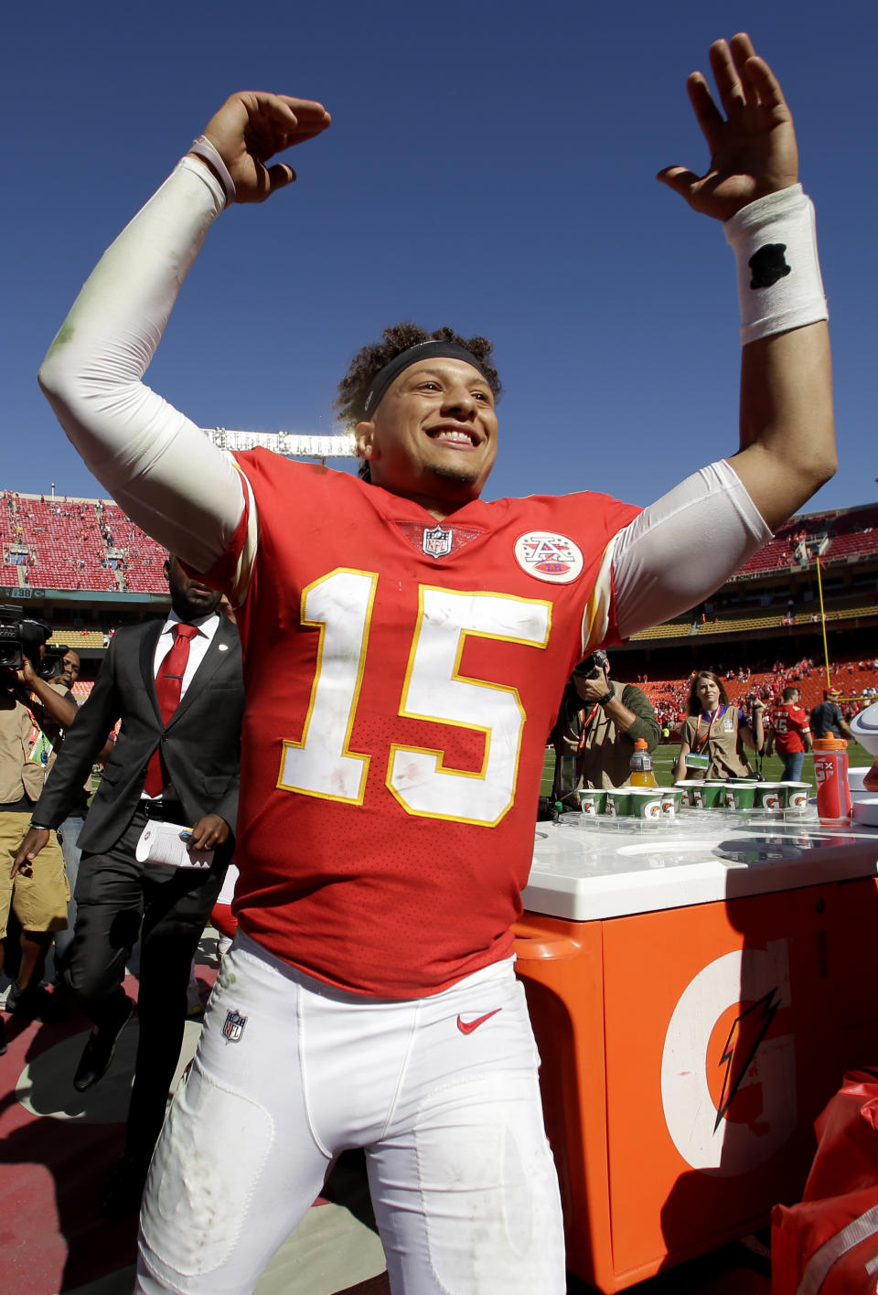 Kansas City Chiefs quarterback Patrick Mahomes (15) celebrates as he comes off the field after an NFL football game against the San Francisco 49ers Sunday, Sept. 23, 2018, in Kansas City, Mo. The Chiefs won 38-27. (AP Photo/Charlie Riedel)