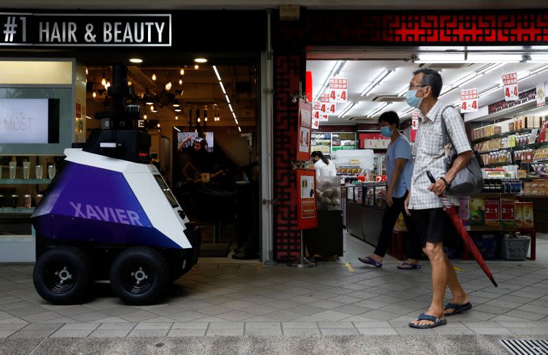 Autonomous robot Xavier patrols a neighbourhood mall to detect "undesirable social behaviours" during a three-week trial in Singapore