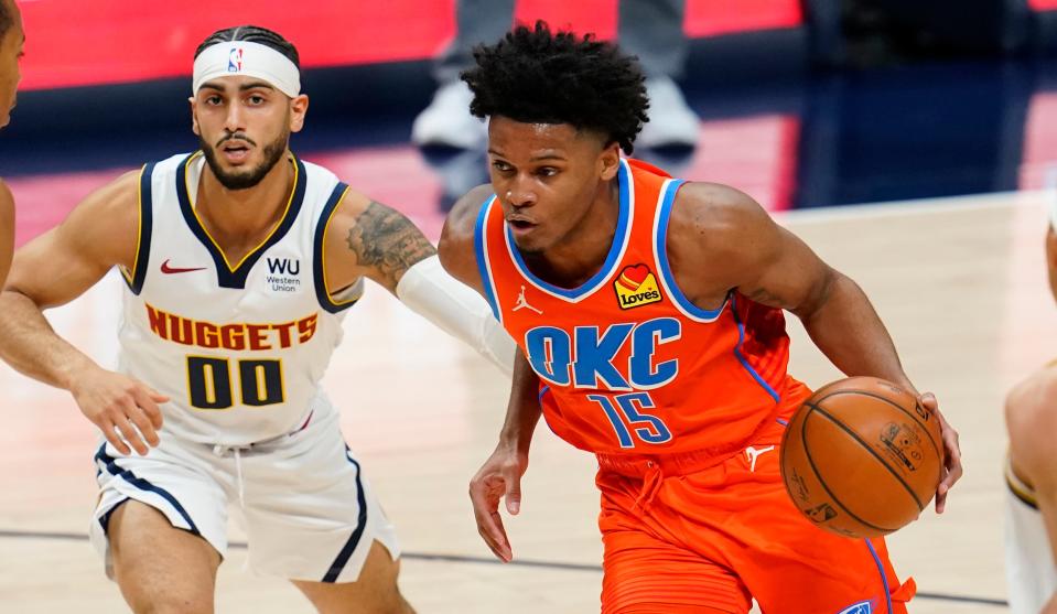 Oklahoma City Thunder forward Josh Hall (15) drives past Denver Nuggets guard Markus Howard (00) in the second half of an NBA basketball game Tuesday, Jan. 19, 2021, in Denver. The Nuggets won 119-101.