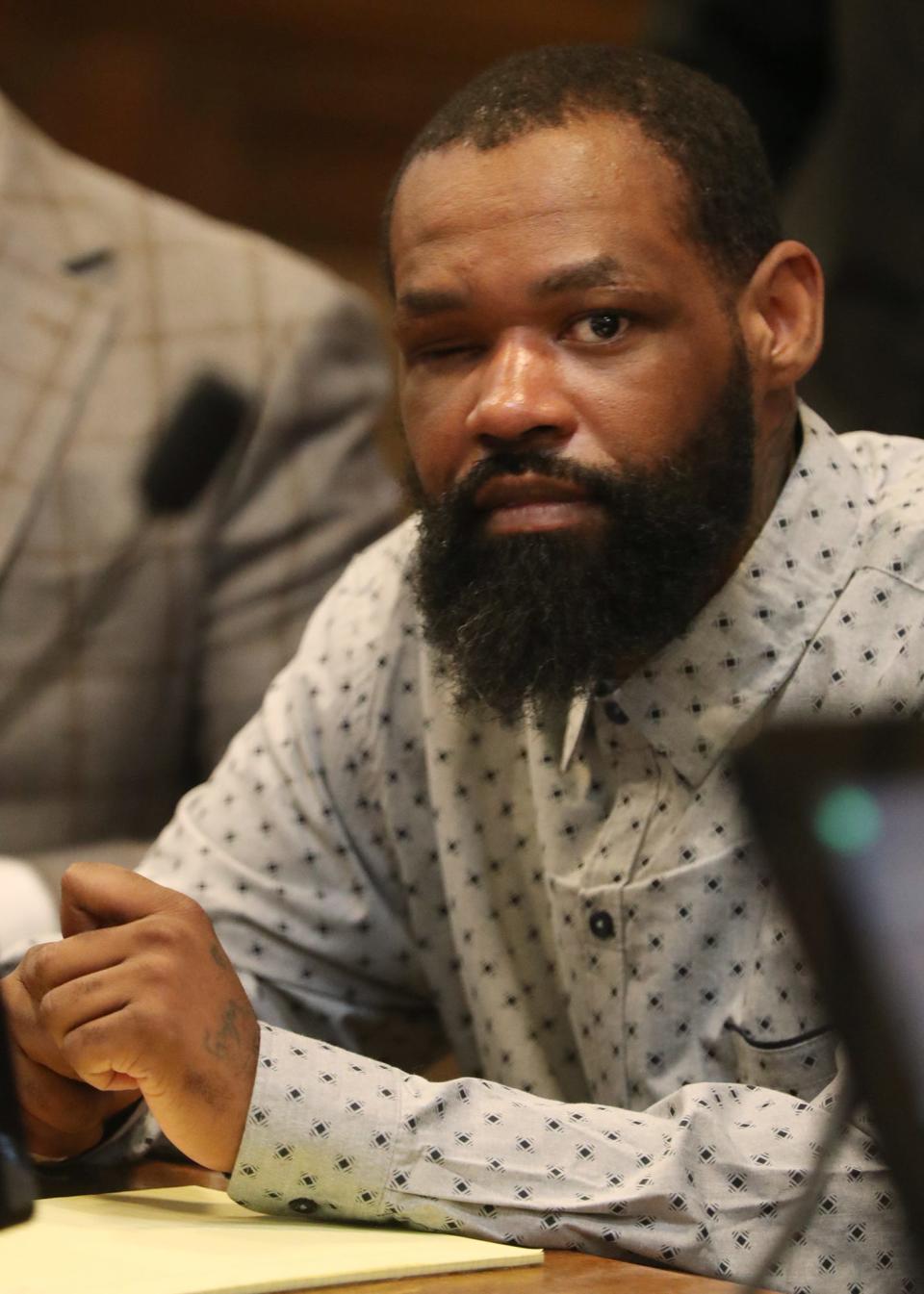 Darrell Buchanan waits for his murder trial to start Monday in Summit County Common Pleas Judge Alison McCarty's courtroom. Buchanan is accused in the shooting death of Joseph Hall in November 2022.