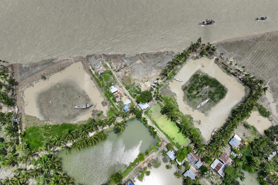 The embankment shows erosion caused by the Meghna River in the Ramdaspur village in the Bhola district of Bangladesh (AP)