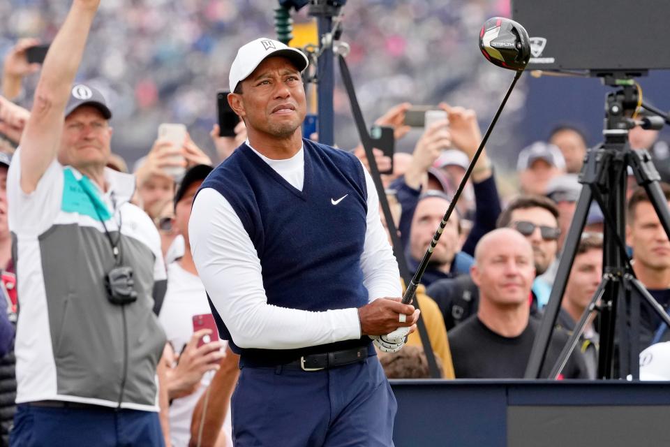 Tiger Woods tees off on the fourth hole during the first round of the 150th Open Championship golf tournament at St. Andrews Old Course.