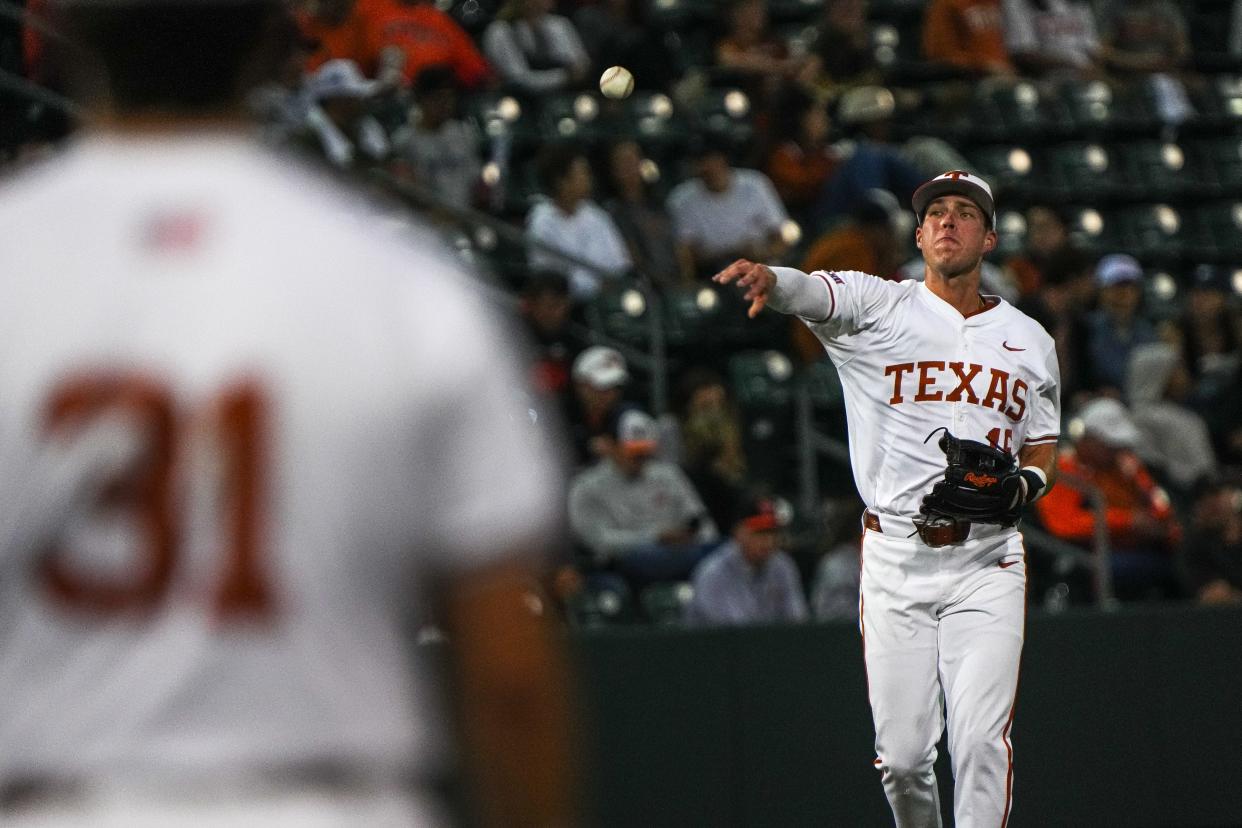 Texas third baseman Peyton Powell throws a ball to first base during Friday's game against Oklahoma State at UFCU Disch–Falk Field.