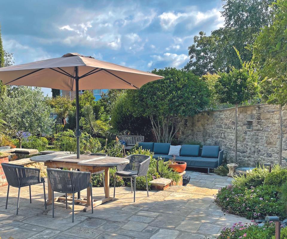 Terrace with parasol and sofa