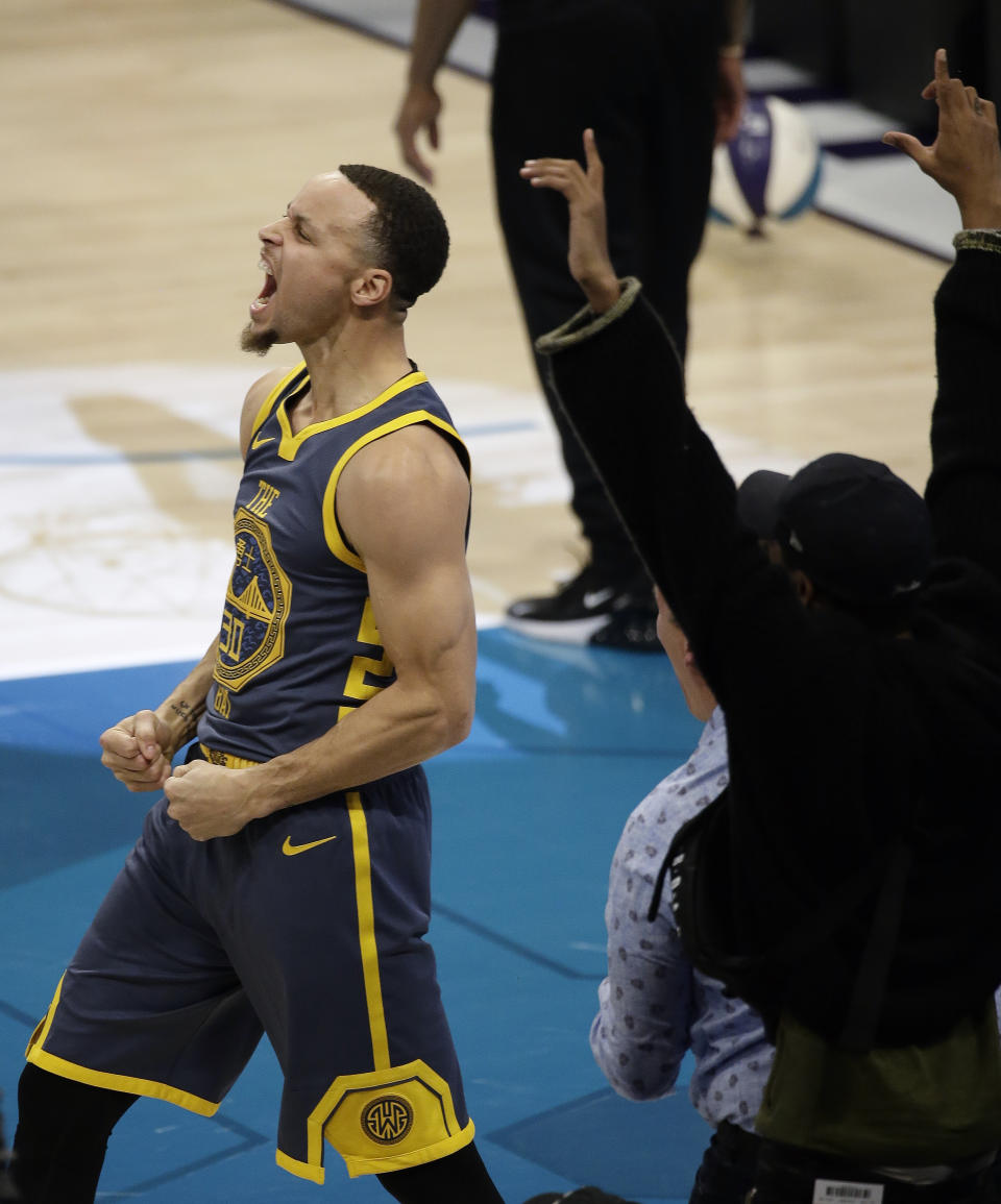 Golden State Warriors Stephen Curry celebrates a series of baskets during the NBA All-Star 3-Point contest, Saturday, Feb. 16, 2019, in Charlotte, N.C. (AP Photo/Gerry Broome)
