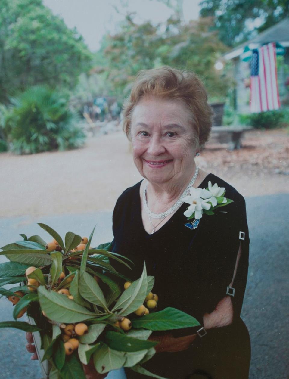 A photo of the late Jean McCully on display in the outside gardens of the newly dedicated Big Bend Hospice family house named in her honor.