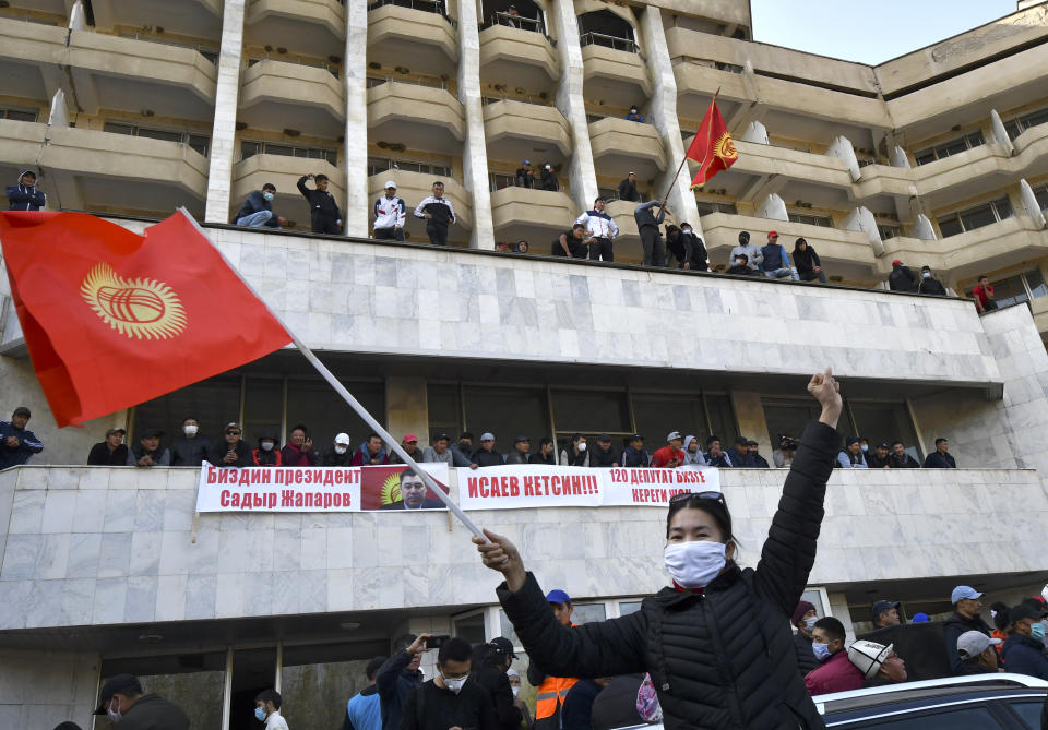 Supporters of Kyrgyzstan's Prime Minister Sadyr Japarov attend a rally in Bishkek, Kyrgyzstan, Thursday, Oct. 15, 2020. Kyrgyzstan President Sooronbai Jeenbekov announced his resignation on Thursday in a bid to end the turmoil that has engulfed the Central Asian nation after a disputed parliamentary election. (AP Photo/Vladimir Voronin)