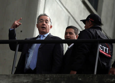 FILE PHOTO: Colombia's former president Alvaro Uribe gestures as he arrives at the attorney building in Bogota in May 13, 2014. REUTERS/John Vizcaino/File Photo