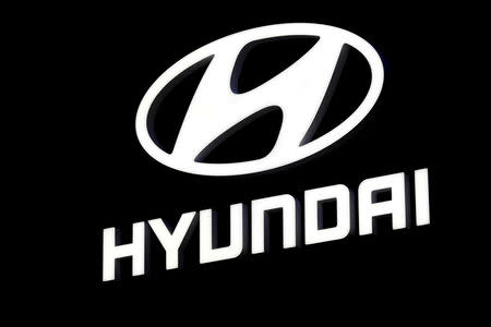 FILE PHOTO: A Hyundai booth displays the company logo at the North American International Auto Show in Detroit, Michigan, U.S., Jan. 16, 2018. REUTERS/Jonathan Ernst