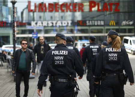 Police walks towards the Limbecker Platz shopping mall in Essen, Germany, March 11, 2017, after it was shut due to attack threat. REUTERS/Thilo Schmuelgen