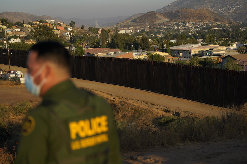 Border Patrol agent Justin Castrejon looks out along newly replaced border wall sections Thursday, Sept. 24, 2020, near Tecate, Calif. / Credit: Gregory Bull / AP