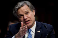 FILE - In this Nov. 5, 2019, file photo, FBI Director Christopher Wray testifies before a Senate Homeland Security Committee hearing on Capitol Hill in Washington. It’s been more than three years since Russia's sweeping effort to interfere in U.S. elections through disinformation on social media, stolen campaign emails and attacks on voting systems. U.S. officials have made advances in trying to prevent similar attacks from undermining the 2020 vote, but challenges remain. (AP Photo/Andrew Harnik, File)
