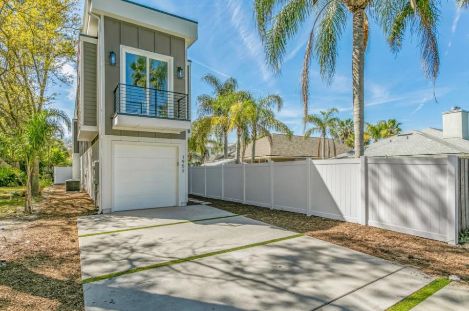 The property includes a notably narrow garage. Open House Optics