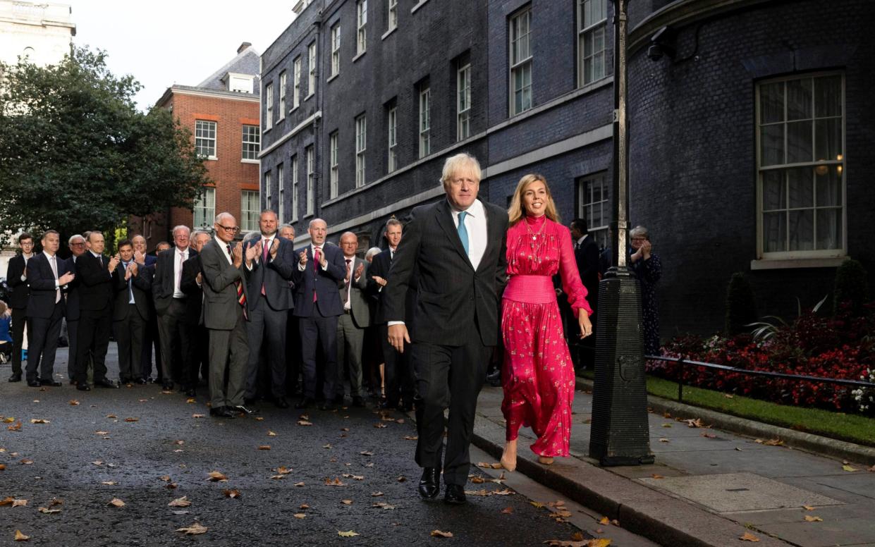 Boris Johnson with his wife Carrie, leaving Downing Street - Simon Dawson