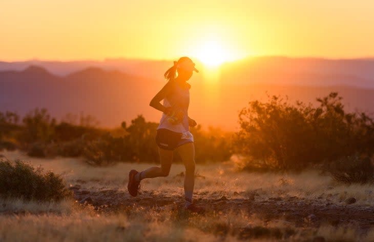 Runner at sunset in the desert