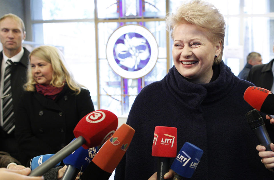 Lithuania's President Dalia Grybauskaite speaks to the media at a polling station in Vilnius, Lithuania, Sunday, Oct. 14, 2012. Lithuanians are expected to deal a double-blow to the incumbent conservative government in national elections Sunday by handing a victory to opposition leftists and populists and saying 'no' to a new nuclear power plant that supporters claim would boost the country's energy independence. (AP Photo/Mindaugas Kulbis)