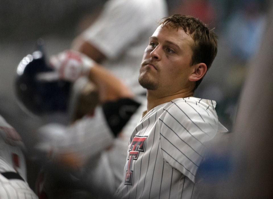 Texas Tech's Cole Stilwell (18) sits in the dugout after the game against Kansas State in an elimination game of the Big 12 baseball tournament, Friday, May 27, 2022, at Globe Life Field in Arlington.  Kansas State won, 6-5, in 11 innings.