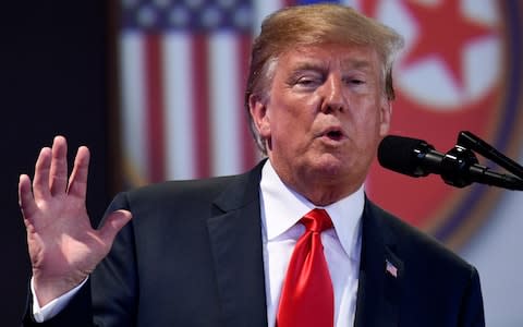 U.S. President Donald Trump answers questions about the summit with North Korea leader Kim Jong Un during a press conference  - Credit: Susan Walsh /AP