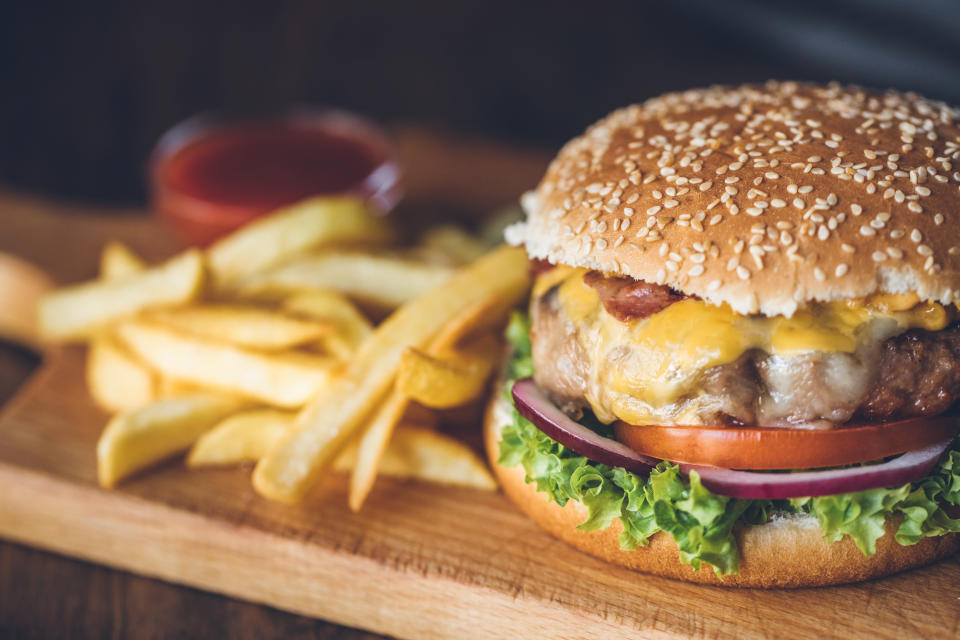 Homemade burgers on rustic wooden background