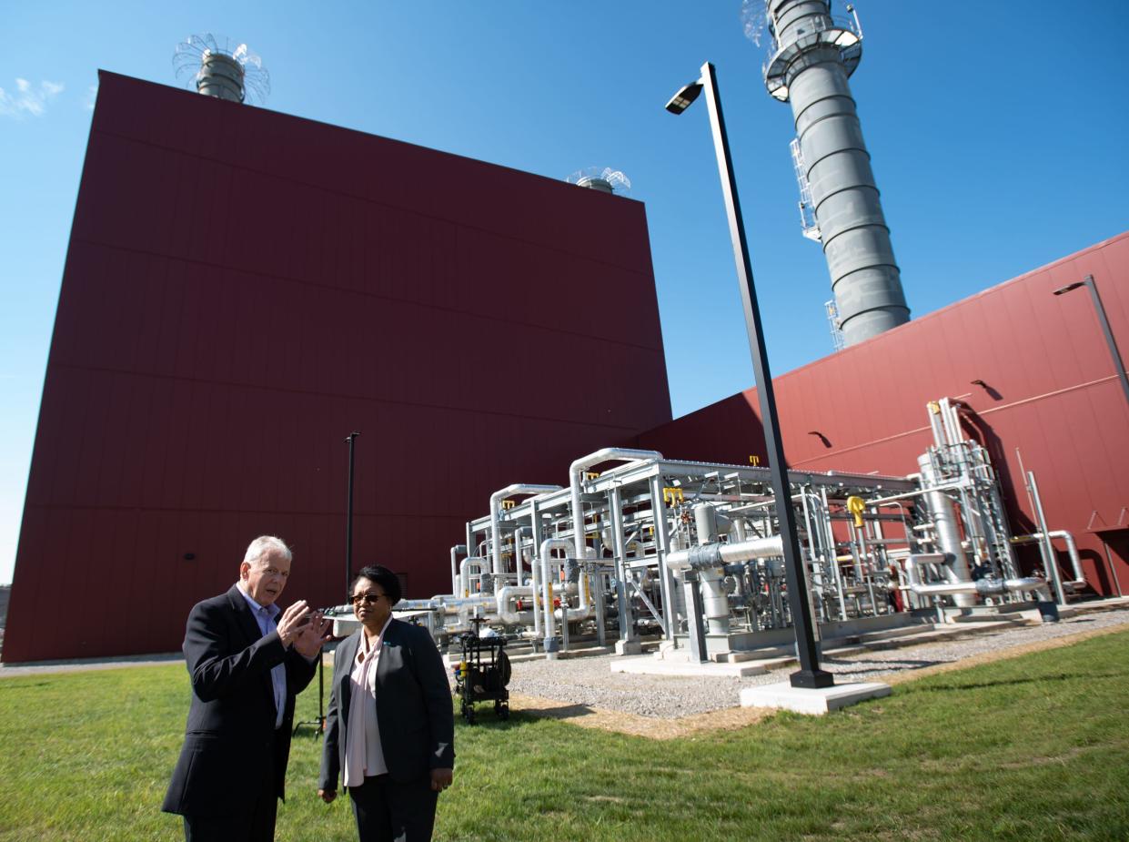 Lansing Board of Water and Light (BWL) General Manager Dick Peffley, left, talks with BWL Board of Commissioners Chair Semon James, Tuesday, Aug. 23, 2022, after the Delta Energy Park public unveiling celebration of the natural gas-fired plant in Delta Township.