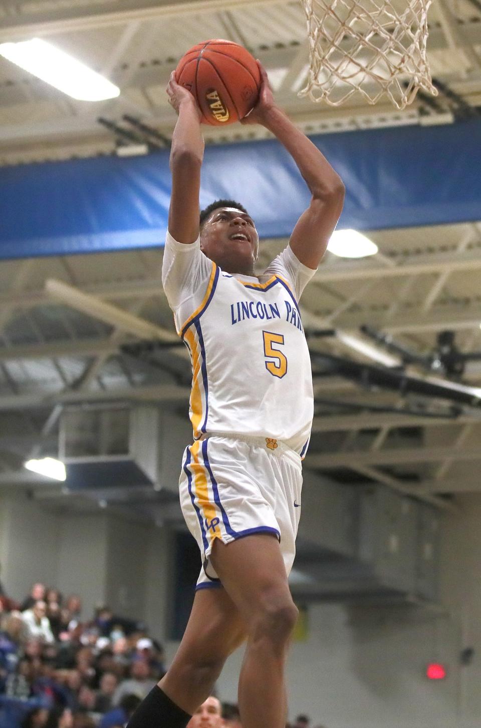 Lincoln Park's Meleek Thomas prepares to dunk the ball during the first half of the PIAA 4A Playoff game against South Allegheny Friday night at Lincoln Park Performing Arts Charter School.