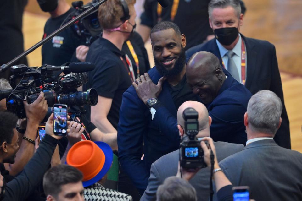 LeBron James and Michael Jordan share a laugh during the halftime ceremony honoring the NBA's 75th anniversary team.