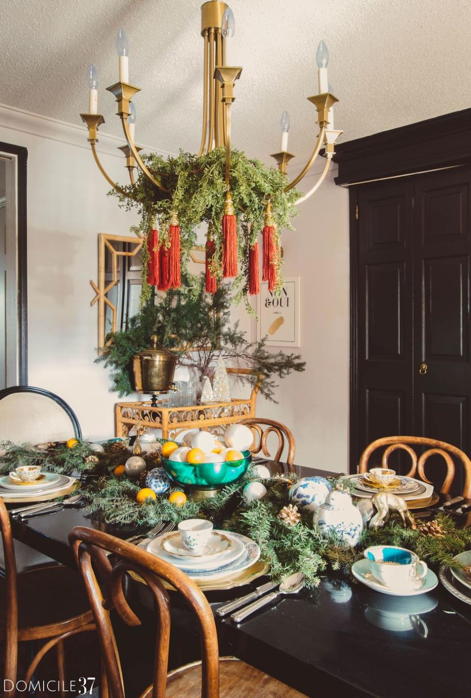 <p>Your Christmas centerpiece should be a reflection of the rest of your home decor. If you want to give your dining table a <a href="https://www.elledecor.com/design-decorate/room-ideas/g10241076/bohemian-room-decor/" rel="nofollow noopener" target="_blank" data-ylk="slk:bohemian;elm:context_link;itc:0;sec:content-canvas" class="link ">bohemian</a> flair, experiment with texture. With leafy greens, tassels, and smooth ornaments, this tablescape option packs in the holiday cheer.</p><p><em><a href="https://www.domicile37.com/orange-christmas-tablescape/" rel="nofollow noopener" target="_blank" data-ylk="slk:Via Domicile 37;elm:context_link;itc:0;sec:content-canvas" class="link ">Via Domicile 37 </a></em></p>