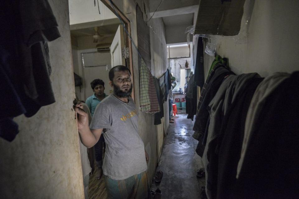 The narrow corridor in the apartment where nine Bangladeshis live. — Picture by Shafwan Zaidon