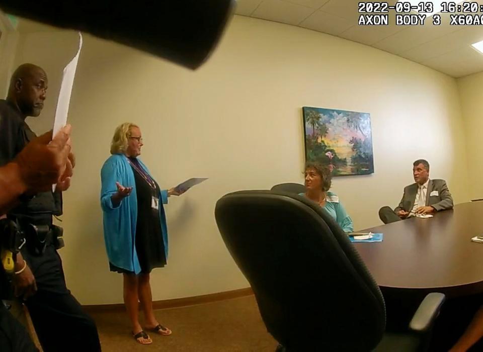 On Sept. 13, 2022, Catholic Charities CEO Ellen Wayne (second from left) tells attorneys Joni Mazzola (middle) and Gary Rooney (right) that Nisarat Jittasonthi is not at the agency's shelter. The attorneys, who provided TCPalm with Riviera Beach police bodycam footage used to make this screen grab, were hired to help Supee Spindler find Jittasonthi, her mentally disabled daughter.