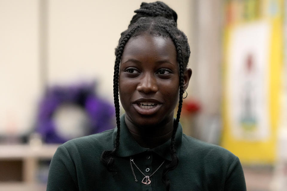 Wells Preparatory Elementary School student Olorunkemi Atoyebi, responds to a question during an interview with The Associated Press on Friday, March 8, 2024, in Chicago. Atoyebi was an A student before the pandemic, but after spending fifth grade behind a computer screen, she fell behind. During remote learning, she was nervous about stopping class to ask questions. Before long, math lessons stopped making sense. When she returned to in classroom learning other students worked in groups, her math teacher helped her one-on-one. Atoyebi learned a rhyming song to help memorize multiplication tables. Over time, it began to click. "They made me feel more confident in everything," said Atoyebi, now 14. "My confidence started going up, my grades started going up, my scores started going up. Everything has felt like I understand it better."(AP Photo/Charles Rex Arbogast)