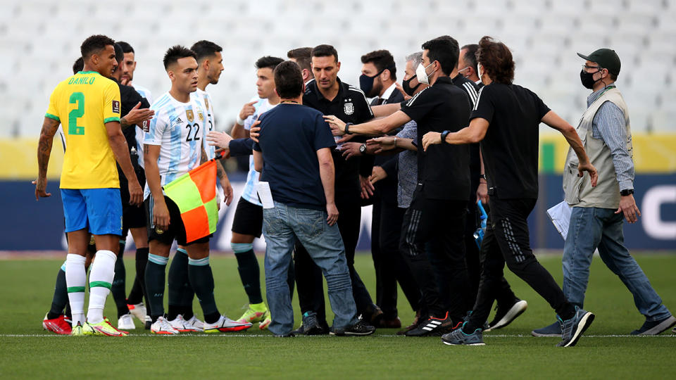 Health staff members, pictured here arguing with Argentina head coach Lionel Scaloni.