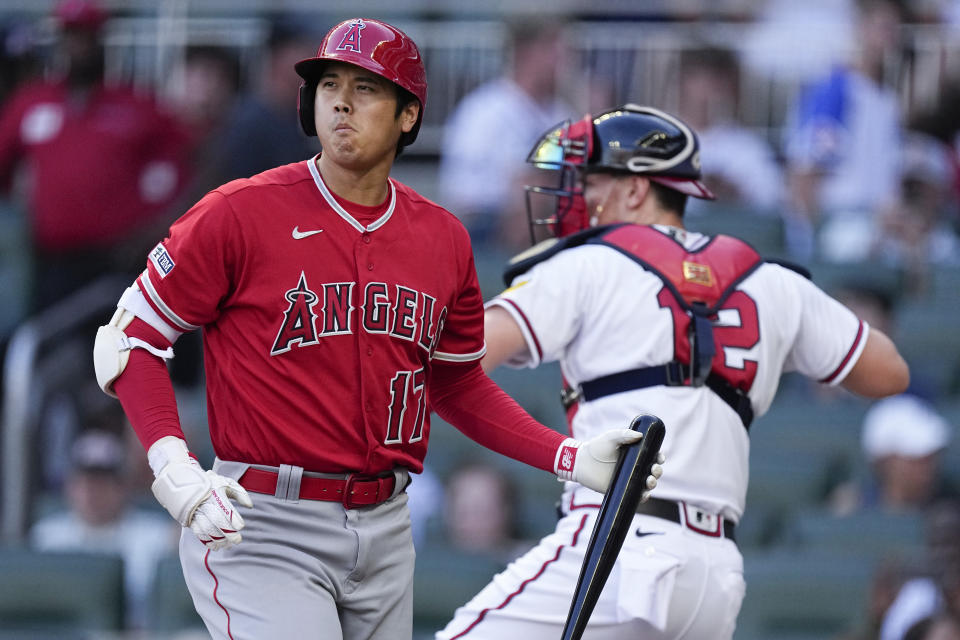 Los Angeles Angels designated hitter Shohei Ohtani strikes out in the first inning of a baseball game against the Atlanta Braves Tuesday, Aug. 1, 2023, in Atlanta. (AP Photo/John Bazemore)