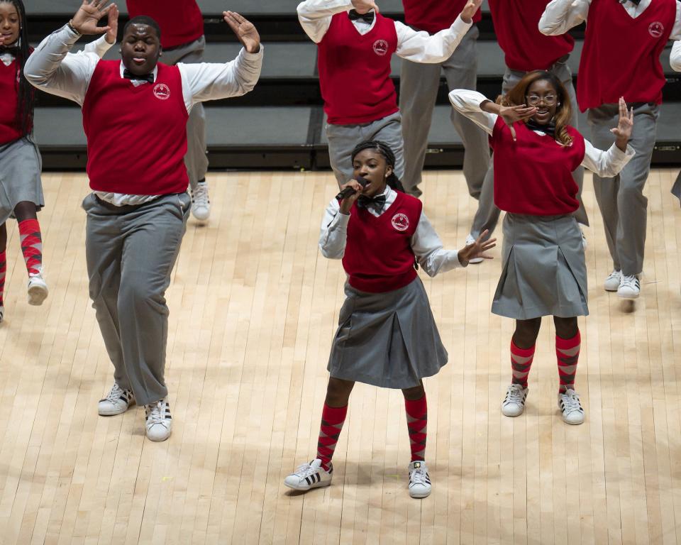 Gwen Jackson (foreground) and members of the Detroit Youth Choir rehearse at Marygrove College in a scene from Disney+'s "Choir."