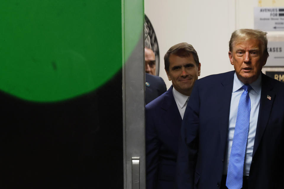 Former U.S. President Donald Trump returns to the courtroom after a lunch recess during his trial at Manhattan criminal court before his trial in New York, Friday, April 26, 2024. (Michael M. Santiago/Pool Photo via AP)