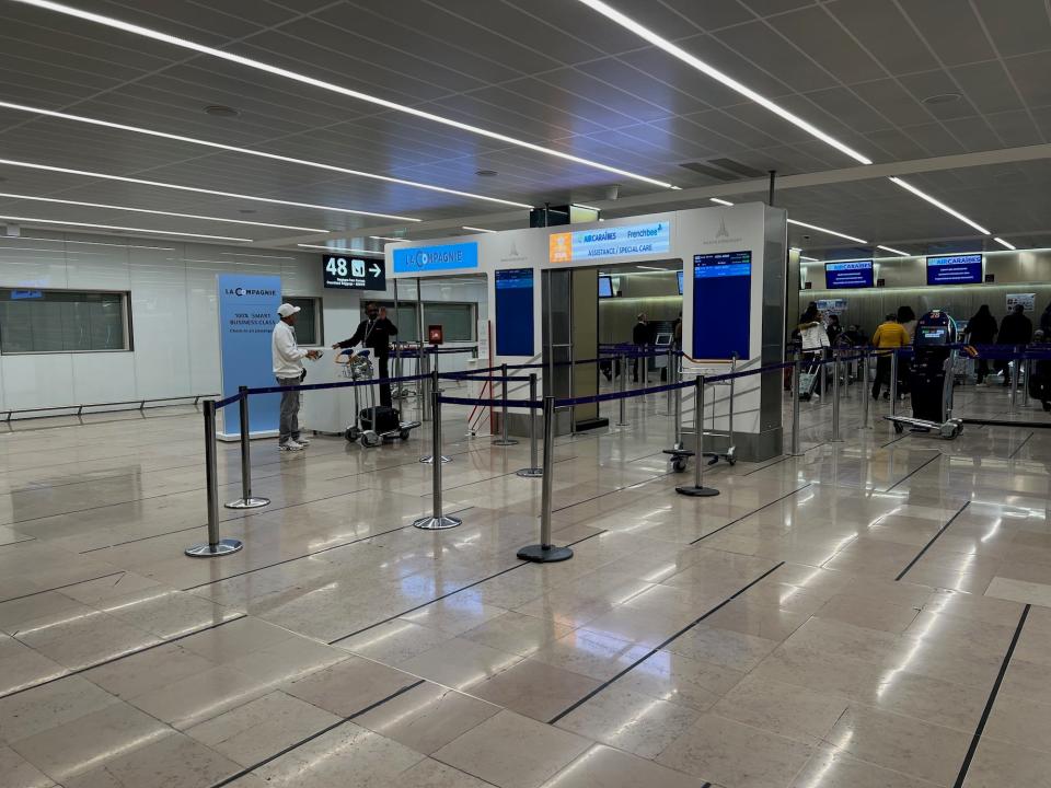 Flying on La Compagnie all-business class airline from Paris to New York — at the check-in counter, number 48 in Orly airport.