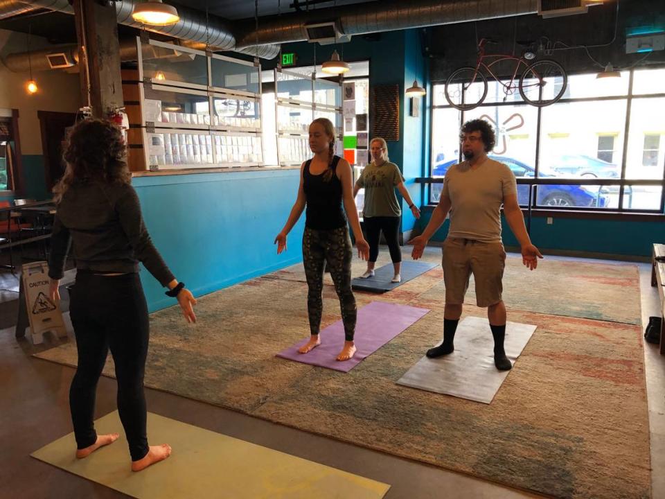 The Bend, Breathe & Beer Yoga classes happen Sundays in Three Magnets Brewing Co.’s barrel room.