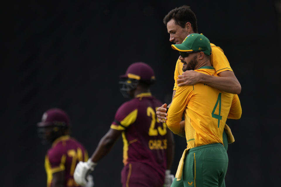 South Africa's Aiden Markram, right, celebrates with bowler Marco Jansen West for dismissing West Indies's batsman Kyle Mayers during the second T20 cricket match between South Africa and West Indies, at Centurion Park, in Pretoria, South Africa, Sunday, March 26, 2023. (AP Photo/Themba Hadebe)