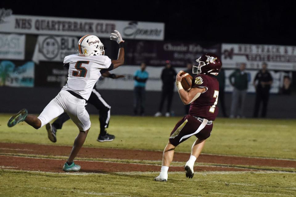 Niceville High School's Maddax Fayard reels in a long pass to help the Eagles tie the game 21-21 against Mosley High School on Thursday, Oct. 27, 2022.