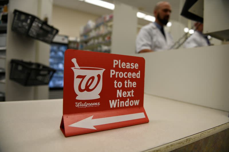 A pharmacist works at a Walgreens pharmacy store in Austin, Texas