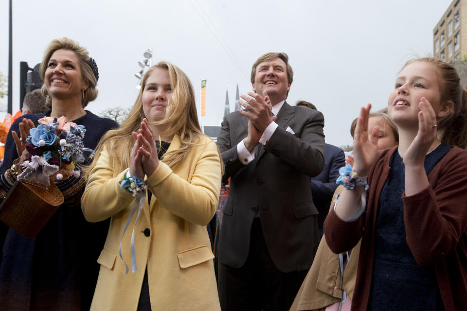 FILE - Queen Maxima, Princess Amalia, Dutch King Willem-Alexander, Princess Ariane and Princess Alexia, from left, take part in celebrations marking the King's 50th anniversary in Tilburg, south central Netherlands, Thursday, April 27, 2017. People in the Netherlands could get to know their future queen a little better Tuesday, Nov. 16, 2021, with the publication of an officially authorized book about Princess Amalia appearing weeks before her 18th birthday. (AP Photo/Peter Dejong, File)