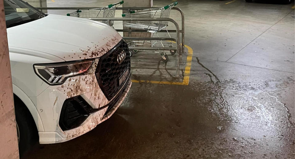 The horrible find can be seen on the white Audi, which is covered with brown streaks after a sewage pipe above the car leaked. 