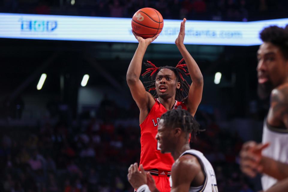 Louisville Cardinals forward Kamari Lands (22) shoots against the Georgia Tech Yellow Jackets in the first half at McCamish Pavilion in Atlanta on Feb. 25, 2023.