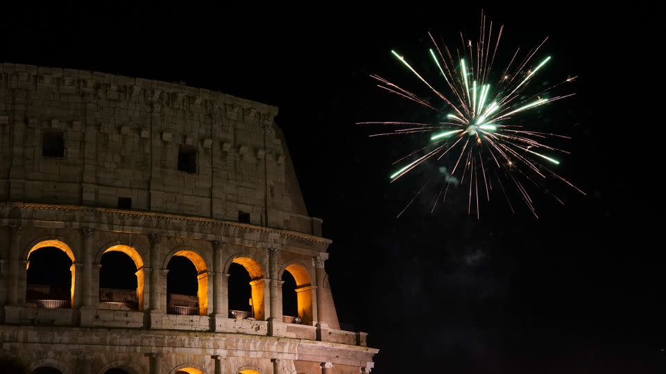 Fireworks explode by Rome's Colosseum during New Year's celebrations on January 1, 2019. - Andrew Medichini/AP