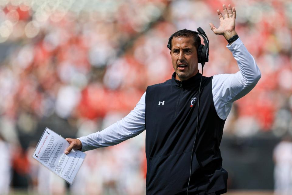 Cincinnati head coach Luke Fickell gestures during the first half of an NCAA college football game against Miami Ohio, Saturday, Sept. 17, 2022, in Cincinnati. Cincinnati won 38-17. (AP Photo/Aaron Doster)