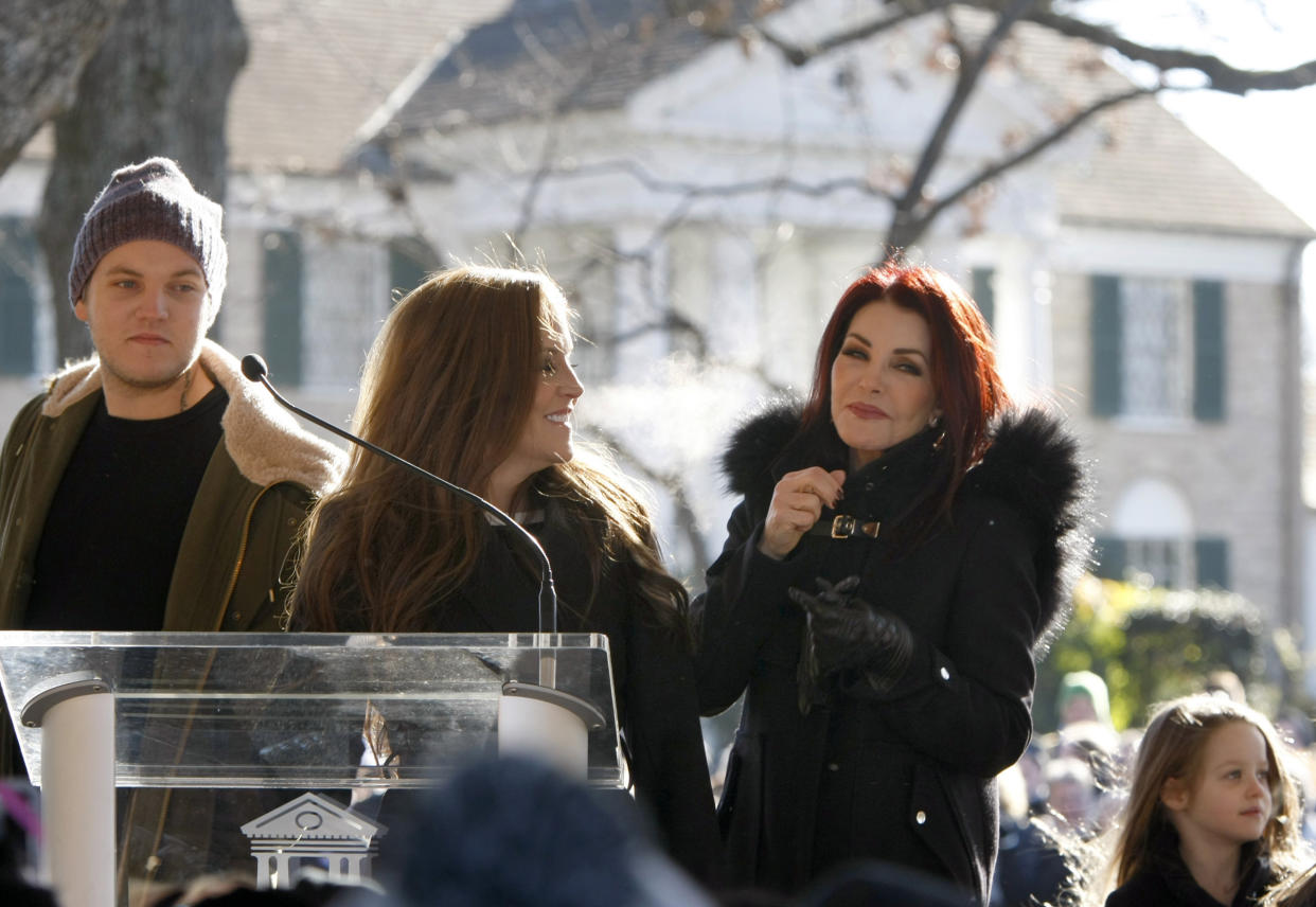 Priscilla Presley (right), Lisa Marie Presley (center) and Ben Keough during a proclamation of Elvis Presley Day by Memphis and Shelby County officials at Graceland in Memphis, Tennessee on Jan. 8, 2015. 