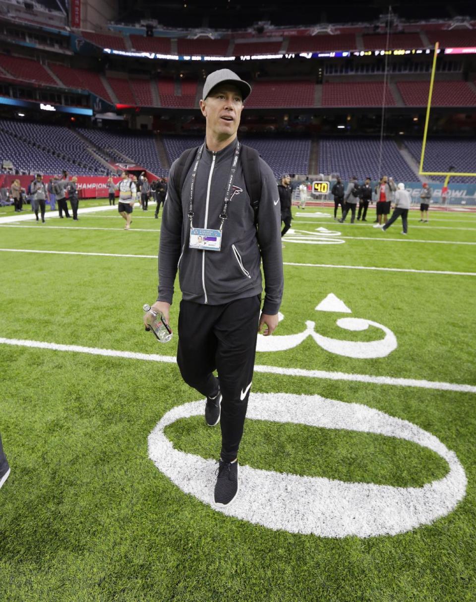 Atlanta Falcons quarterback Matt Ryan walks on the field during a visit to NRG Stadium for a walk through on the eve of NFL Super Bowl 51 football game Saturday, Feb. 4, 2017, in Houston. Atlanta will face the New England Patriots in the Super Bowl Sunday. (AP Photo/Eric Gay)