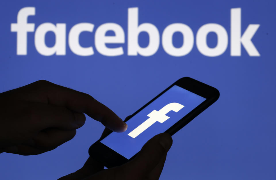 PARIS, FRANCE - SEPTEMBER 09: In this photo illustration, the Facebook logo is displayed on the screen of a smartphone in front of a computer screen displaying the logo of Facebook on September 09, 2019 in Paris, France. Several US states have launched antitrust investigations against web giants including Facebook and Google with the viewer their business practices, but also the collection and exploitation of personal data. In total, eight states have announced, via the attorneys general, the opening of an antitrust investigation against Facebook social media. (Photo by Chesnot/Getty Images)