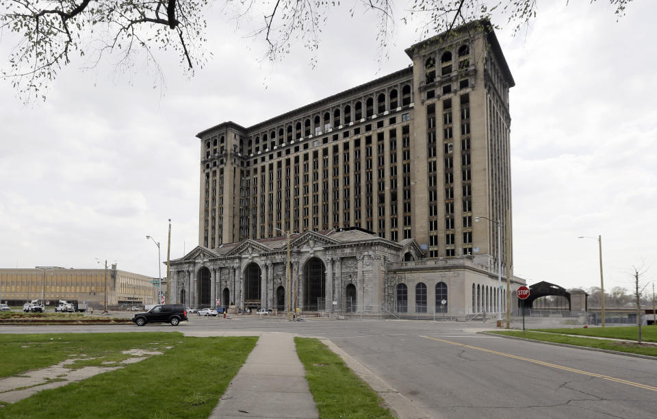 FILE - The vacant Michigan Central Station is shown on April 29, 2015, in Detroit. On July 18, 2013, a state-appointed manager made Detroit the largest U.S. city to file for bankruptcy. A decade later, the Motor City has risen from the ashes of insolvency, with balanced budgets, revenue increases and millions of dollars socked away. Corktown, a neighborhood just east of downtown, got a boost in 2018 when Ford Motor Co. bought and began renovating the train station, which for years was a symbol of the city's blight. The building will be part of a campus focusing on autonomous vehicles. (AP Photo/Carlos Osorio, File)