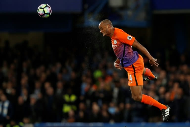 Manchester City's defender Vincent Kompany heads the ball during the English Premier League football match between Chelsea and Manchester City at Stamford Bridge in London on April 5, 2017